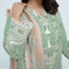 A model wearing a mint green embroidered Eid dress with lace detailing and printed dupatta – Amzoclothing Summer Festive Collection 2025.