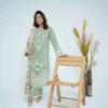 A model wearing a mint green embroidered Eid dress with lace detailing and printed dupatta – Amzoclothing Summer Festive Collection 2025.