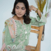A model wearing a mint green embroidered Eid dress with lace detailing and printed dupatta – Amzoclothing Summer Festive Collection 2025.