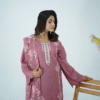 A model wearing Amzoclothing’s Dusty Mauve 3-piece cotton suit with boring embroidery, laser cutwork sleeves, cutwork trousers, and embroidered chiffon dupatta – Eid festive wear 2025.