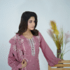 A model wearing Amzoclothing’s Dusty Mauve 3-piece cotton suit with boring embroidery, laser cutwork sleeves, cutwork trousers, and embroidered chiffon dupatta – Eid festive wear 2025.