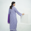 A model wearing Amzoclothing’s Cerulean Blue 3-piece embroidered lawn suit with white threadwork and ombre chiffon dupatta – Eid and summer festive wear 2025.