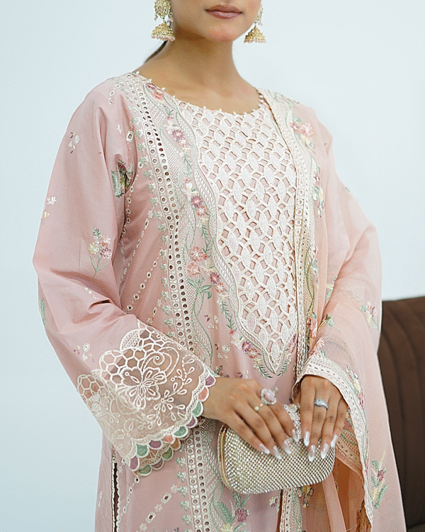 Model wearing rose pink embroidered cotton dress with cutwork neckline, organza sleeves, and heavy dupatta by Amzoclothing