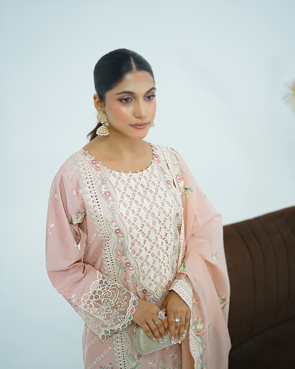 Model wearing Dessert rose pink embroidered cotton dress with cutwork neckline, organza sleeves, and heavy dupatta by Amzoclothing