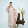 Model wearing rose pink embroidered cotton dress with cutwork neckline, organza sleeves, and heavy dupatta by Amzoclothing