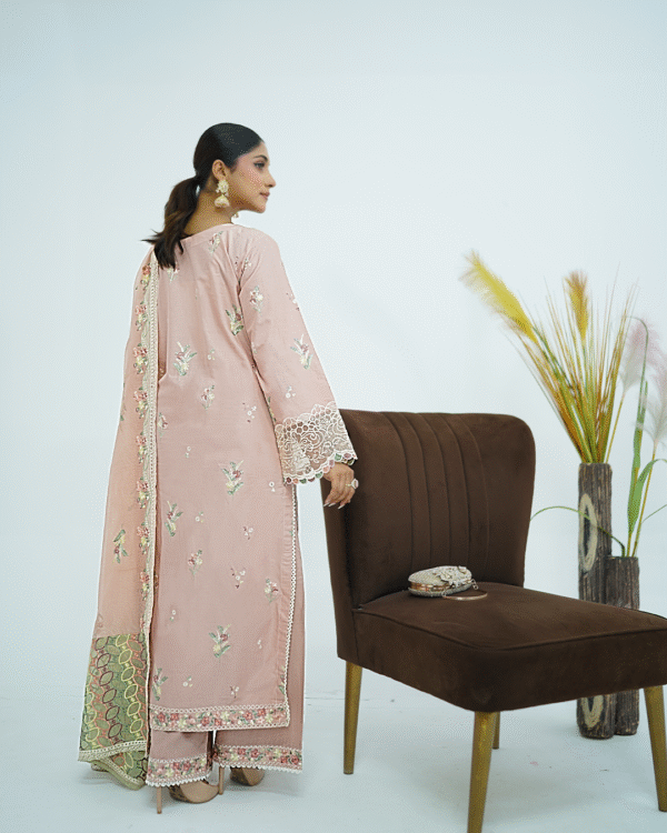 Model wearing rose pink embroidered cotton dress with cutwork neckline, organza sleeves, and heavy dupatta by Amzoclothing