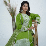 A model wearing lLime Twist - Luxury Stitched cotton embroidered dress with sequin and pearl detailing, paired with a printed viscose dupatta – Amzoclothing Festive Collection 2025.