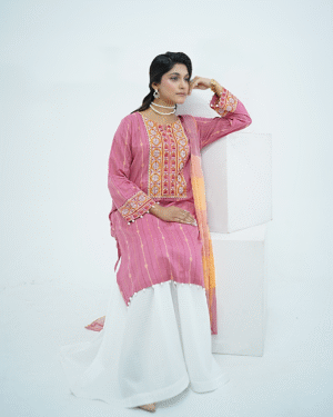 Model in pink embroidered lawn Eid dress with pearl details, white sharara pants, and printed net dupatta – Amzoclothing Eid 2025.
