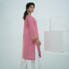 Model in pink embroidered lawn Eid dress with pearl details, white sharara pants, and printed net dupatta – Amzoclothing Eid 2025.