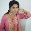 Model in pink embroidered lawn Eid dress with pearl details, white sharara pants, and printed net dupatta – Amzoclothing Eid 2025.