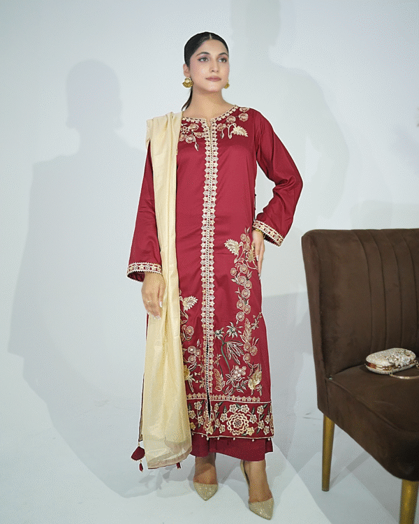 A model wearing a Maroon gold sequin embroidered festive shirt with masuri gold dupatta featuring traditional tassel hangings – Eid/wedding outfit by Amzoclothing.