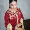 Girl wearing Maroon cotton satin embroidered dress with gold tilla and sequin detailing, paired with masuri gold dupatta featuring traditional tassels – Festive wear from Amzoclothing Eid collection 2025