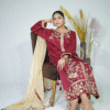A model wearing a maroon elegance gold sequin embroidered festive shirt with masuri gold dupatta featuring traditional tassel hangings – Eid/wedding outfit by Amzoclothing.